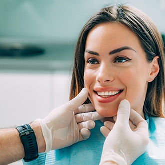 Woman with traditional braces smiling outside