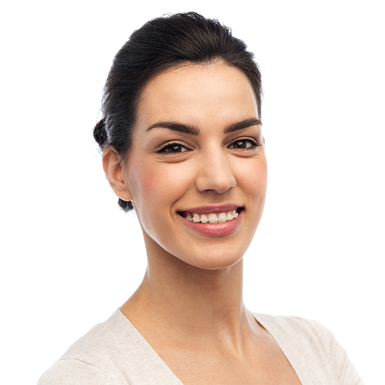 woman with clear and ceramic braces smiling