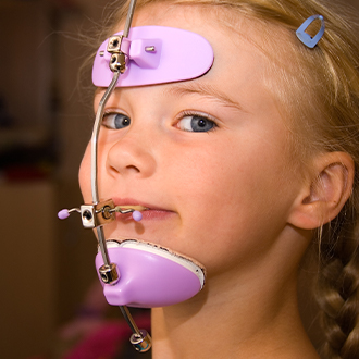 Young girl with head gear