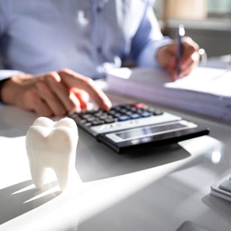 Patient calculating cost of Invisalign in Rutland