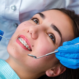Woman visiting Rutland orthodontist for emergency orthodontic treatment 