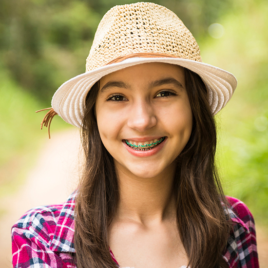 Smiling preteen boy with braces