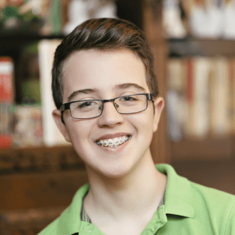 Teen boy with traditional braces