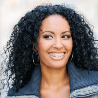 Adult woman with clear and ceramic braces